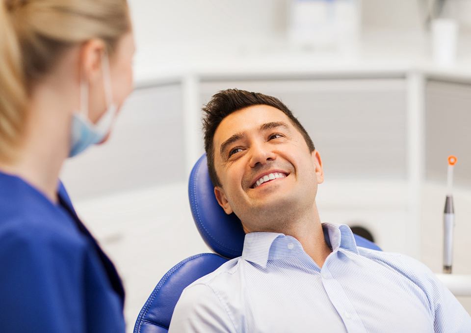 Man smiling in dental chair