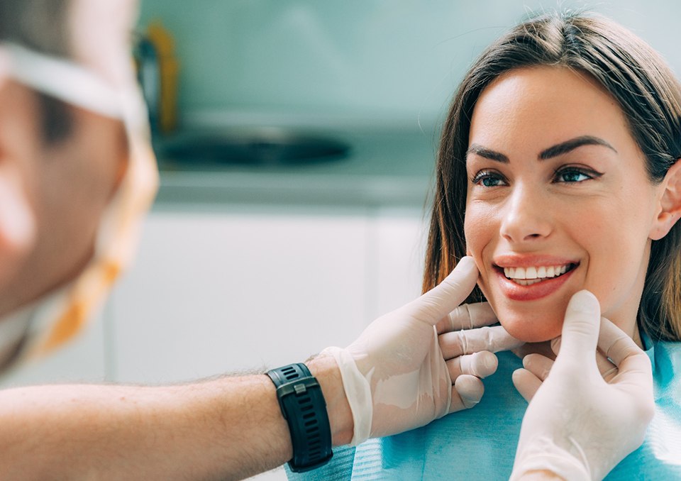 Woman smiling at dental office