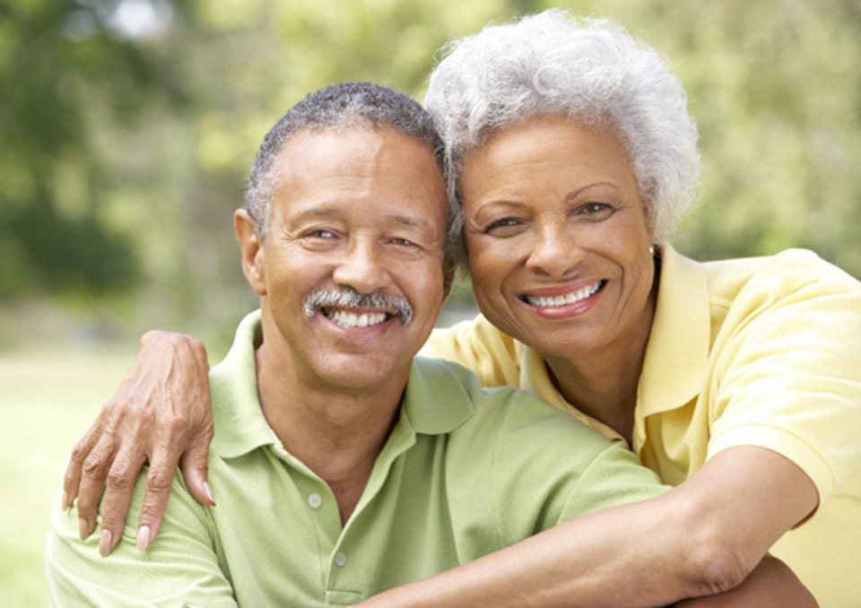 Couple with dental implants in Richardson smiling