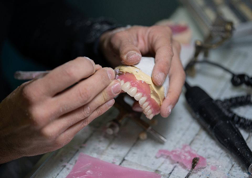 Lab tech carving dentures