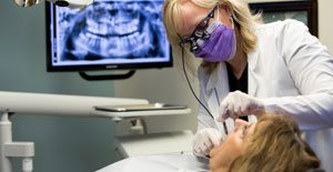 Dentist providing general dentistry services