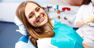 Woman smiling after sedation dentistry visit