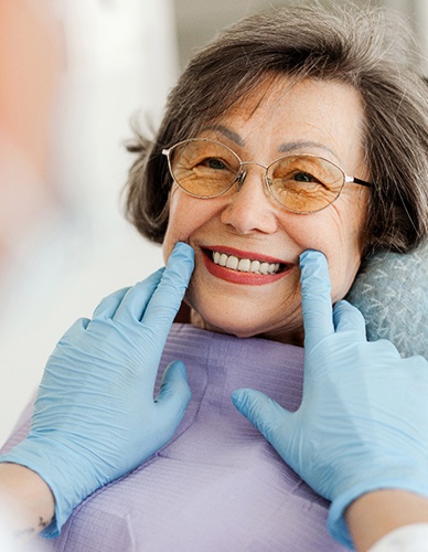 Dentist examining patient's teeth