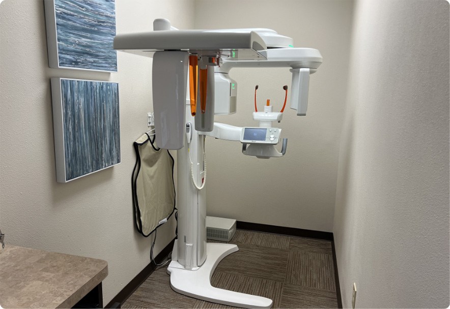 Dental scanning machine standing against a wall