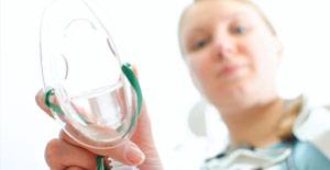 Dentist holding nitrous oxide dental sedation mask